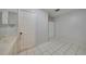 Clean bathroom with white tile floors and a large mirror at 103 Atwater St, Port Charlotte, FL 33954