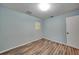 Light blue bedroom with wood-look floors at 103 Atwater St, Port Charlotte, FL 33954