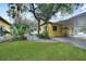 Covered carport with additional storage shelving at 103 Atwater St, Port Charlotte, FL 33954