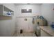 Functional laundry room with washer and dryer hookups, and water heater at 103 Atwater St, Port Charlotte, FL 33954