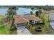 Property showcasing lakefront location and landscaping at 1115 Venture Ct, Punta Gorda, FL 33983