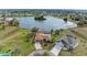 Aerial view of house and community with lake access at 1115 Venture Ct, Punta Gorda, FL 33983