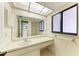 Clean bathroom, featuring a vanity, sink and large mirror at 1115 Venture Ct, Punta Gorda, FL 33983