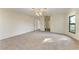 Large bedroom with ample natural light and carpet flooring at 1115 Venture Ct, Punta Gorda, FL 33983