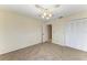 Bedroom with carpet, ceiling fan and built-in closet at 1115 Venture Ct, Punta Gorda, FL 33983