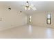 Bedroom with vaulted ceiling and two windows at 1115 Venture Ct, Punta Gorda, FL 33983