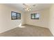 Well-lit bedroom with carpet, ceiling fan and large windows at 1115 Venture Ct, Punta Gorda, FL 33983