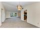 Dining room with chandelier and kitchen access at 1115 Venture Ct, Punta Gorda, FL 33983