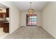 Dining room with chandelier and lake view at 1115 Venture Ct, Punta Gorda, FL 33983