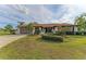 Single-story home with stone accents and driveway at 1115 Venture Ct, Punta Gorda, FL 33983