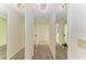 Long hallway with mirrored closet doors and carpet flooring at 1115 Venture Ct, Punta Gorda, FL 33983