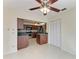 Kitchen features dark wood cabinets and granite countertops at 1115 Venture Ct, Punta Gorda, FL 33983