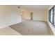 Living room with carpet flooring and view to backyard at 1115 Venture Ct, Punta Gorda, FL 33983