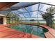 Relaxing screened pool area overlooking a tranquil lake at 1115 Venture Ct, Punta Gorda, FL 33983