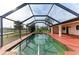 Screened in pool with a view of the lake at 1115 Venture Ct, Punta Gorda, FL 33983