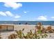 Scenic beach with calm water and clear skies at 12071 Claremont Dr, Port Charlotte, FL 33981