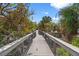 Scenic boardwalk through lush vegetation to the beach at 12071 Claremont Dr, Port Charlotte, FL 33981