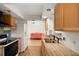 Kitchen with butcher block countertops and view to living room at 12071 Claremont Dr, Port Charlotte, FL 33981