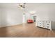 Bright living room with hardwood floors and coral sofa at 12071 Claremont Dr, Port Charlotte, FL 33981