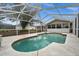 Inviting screened-in pool area with ample deck space at 12071 Claremont Dr, Port Charlotte, FL 33981