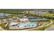 Resort-style pool, tennis courts, clubhouse, and parking at 14150 Poppy Field Loop # 4322, Punta Gorda, FL 33955