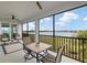 Spacious screened patio with lake view and seating area at 14150 Poppy Field Loop # 4322, Punta Gorda, FL 33955