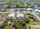 Aerial view of canal-front property with pool and detached garage at 14303 Maysville Cir, Port Charlotte, FL 33981