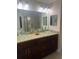 Elegant bathroom with double vanity, glass sinks, and large shower at 14303 Maysville Cir, Port Charlotte, FL 33981