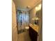 Bathroom with glass shower and granite vanity at 14303 Maysville Cir, Port Charlotte, FL 33981