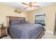 Guest bedroom with king bed and rustic decor at 14303 Maysville Cir, Port Charlotte, FL 33981