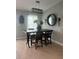 Dining area with rustic table and four chairs at 14303 Maysville Cir, Port Charlotte, FL 33981