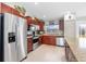 Kitchen with stainless steel appliances and wood cabinets at 14303 Maysville Cir, Port Charlotte, FL 33981