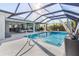 Enjoy this relaxing pool area with covered lanai and refreshing pool at 14303 Maysville Cir, Port Charlotte, FL 33981