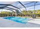 Inviting screened pool with ample surrounding patio space at 14303 Maysville Cir, Port Charlotte, FL 33981