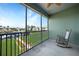 Balcony with marina view and a rocking chair at 1431 Aqui Esta Dr # 221, Punta Gorda, FL 33950