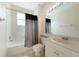 Clean bathroom with a bathtub, toilet and vanity at 1431 Aqui Esta Dr # 221, Punta Gorda, FL 33950