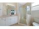 Clean bathroom with updated vanity and shower at 1431 Aqui Esta Dr # 221, Punta Gorda, FL 33950