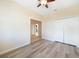 Bedroom with wood-look floors, double closets and en-suite bathroom at 1431 Aqui Esta Dr # 221, Punta Gorda, FL 33950