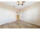 Bright bedroom with wood-look flooring and ceiling fan at 1431 Aqui Esta Dr # 221, Punta Gorda, FL 33950