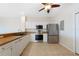 Kitchen features stainless steel appliances and light wood cabinets at 1431 Aqui Esta Dr # 221, Punta Gorda, FL 33950