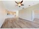 Spacious living room with laminate flooring and ceiling fan at 1431 Aqui Esta Dr # 221, Punta Gorda, FL 33950