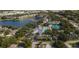 Community overview with pool, tennis courts, and lake at 1447 Red Oak Ln, Port Charlotte, FL 33948