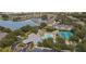 Community overview with pool, tennis courts, and lake at 1447 Red Oak Ln, Port Charlotte, FL 33948