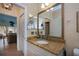 Bathroom with granite countertop and large vanity mirror at 1447 Red Oak Ln, Port Charlotte, FL 33948