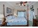 Main bedroom with a post bed and ceiling fan at 1447 Red Oak Ln, Port Charlotte, FL 33948