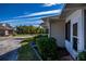 Exterior view of the home, showcasing its address and landscaping at 1447 Red Oak Ln, Port Charlotte, FL 33948