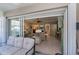 View of living room from covered patio with sliding doors at 1447 Red Oak Ln, Port Charlotte, FL 33948