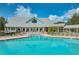 Community swimming pool with surrounding lounge area at 1447 Red Oak Ln, Port Charlotte, FL 33948