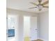 Light bedroom with ceiling fan and access to bathroom at 1612 Nuremberg Blvd, Punta Gorda, FL 33983