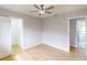 Bright bedroom with hardwood floors and ceiling fan at 1612 Nuremberg Blvd, Punta Gorda, FL 33983